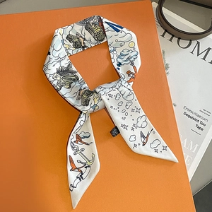 Silk twilly scarf with colorful illustrations of birds and planes on orange gift box