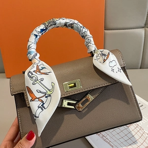 Litchi pattern leather handbag in elephant grey with silk scarf wrapped handle