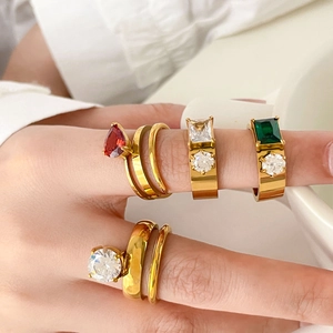 Elegant gold titanium steel ring set featuring colorful zircon stones on model hand