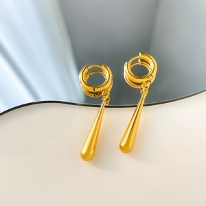 Close-up of gold-plated stainless steel C-shape hoop earrings with long teardrop pendants