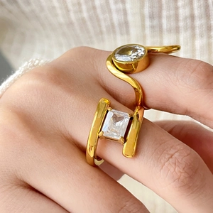 Set of 18K gold-plated titanium steel rings with geometric cubic zirconia on a hand