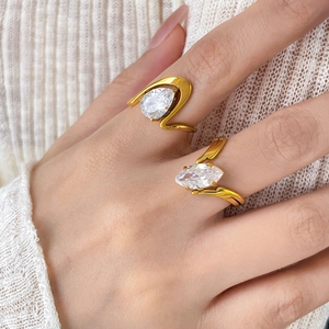 Detail of 18K gold plated titanium ring with pear and marquise-cut zircon stones