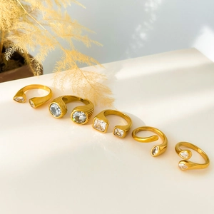 Five 18K gold-plated snake and geometric rings with zircon settings in a minimal style