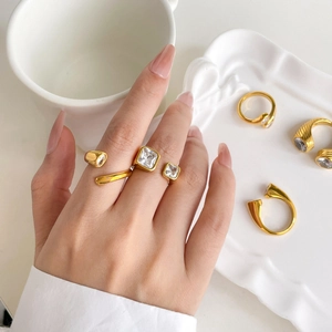 Close-up of 18K gold plated snake-style ring with square zircon and textured metal band