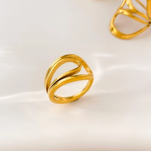 Macro view of 18K gold plated ring featuring sleek minimalist double wavy curved lines