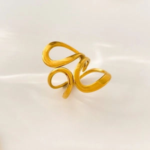 Detail view of 18K gold plated stainless steel ring with abstract curved flowing lines