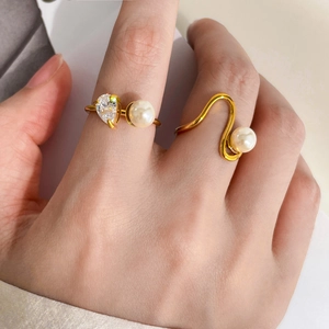 Golden teardrop crystal and pearl curved ring set with minimalist elegant lines