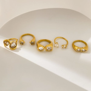 Set of five 18K gold plated stainless steel rings with zircon stars and teardrop stones