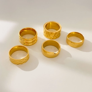 Set of five 18K gold plated stainless steel rings with assorted textured patterns
