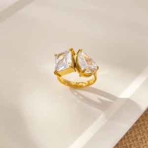 Detail of 18K gold-plated ring featuring square and teardrop-cut cubic zirconia