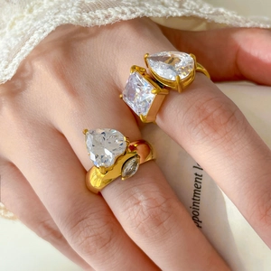 Macro view of 18K gold plated rings with large heart and teardrop shaped zircon stones