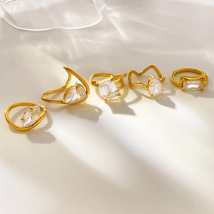 Set of five 18K gold plated rings with emerald, pear and marquise cut cubic zirconia