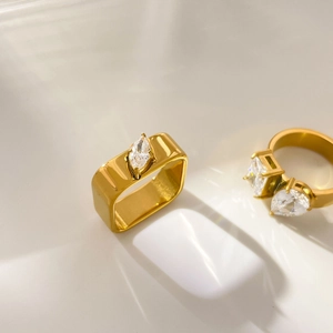 Detailed view of 18K gold plated rings featuring marquise and heart-cut cubic zirconia stones