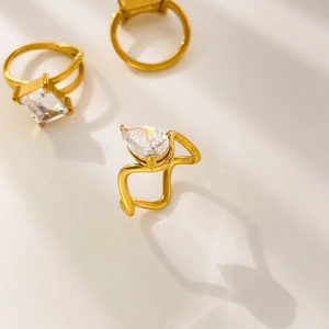 Close-up of 18K gold plated rings with large pear and rectangle cut zircon stones