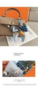 Detail of high-quality twill silk scarf wrapped on a handbag handle with vintage chain pattern