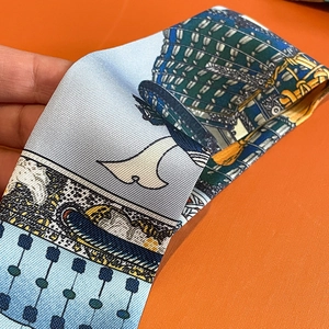 Close-up of premium silk twill scarf with Ukiyo-e wave patterns and rich texture