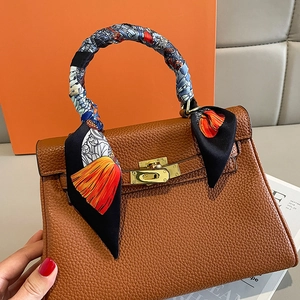 Brown lychee leather handbag with golden lock and floral silk scarf wrapped handle