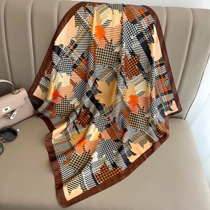 Houndstooth and maple leaf print silk scarf with satin finish and orange accents
