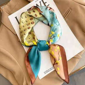 French vintage silk square scarf with blue and yellow floral patterns on a blazer