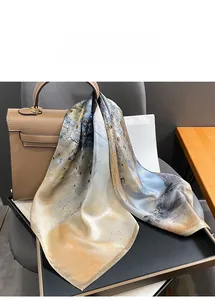 Detail showing an abstract silk square scarf styled as an elegant handbag accessory