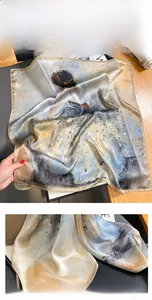 Detailed close-up showing precision machine-stitched edges on an abstract silk scarf