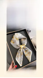 Detail of 70x70cm pure mulberry silk square scarf with yellow floral print and geometric lines