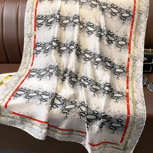 Faux silk scarf with snake skin pattern, red belt print and golden chain borders