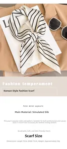 Detail of camellia patterned silk scarf styled as a neck tie on a beige blazer jacket
