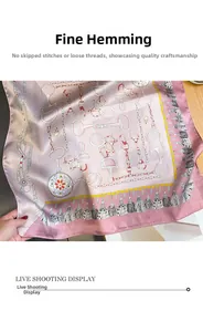 Gros plan d'un foulard en soie avec motifs de chaînes et bords finement surjetés