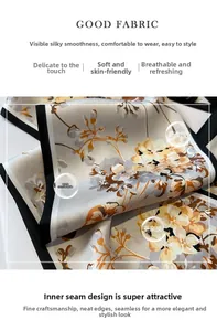 Détail d'un foulard en soie à motif floral jaune et bordures noires contrastées