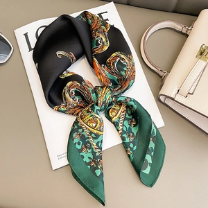 Baroque animal print silk scarf styled with handbag and sunglasses on magazine