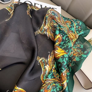 Detail of premium silk-like square scarf with phoenix totem and leopard print
