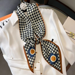 Houndstooth silk scarf for women styled with a camellia brooch on a white shirt