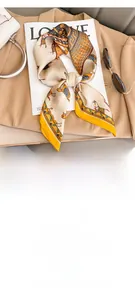 Flat lay of vintage horse print silk scarf measuring 70x70cm with yellow borders