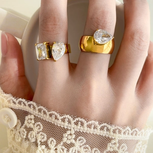 Detail of 18K gold plated double-layer rings with teardrop and square zircon stones