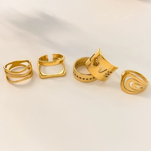 Stackable 18K gold plated titanium rings set with hollow LOVE and geometric designs