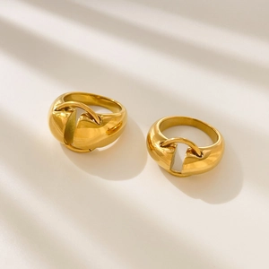 Detail of 18K gold-plated titanium steel rings with U-shaped design and smooth finish
