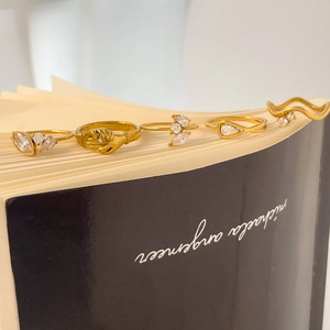 Five-piece set of 18K gold plated zircon rings with eye, teardrop and wave designs