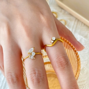 18K gold plated titanium wavy rings with cubic zirconia eye and teardrop accents