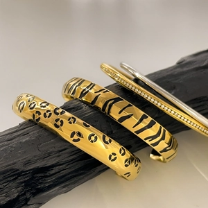 Set of four leopard and zebra print bracelets in 18K gold and silver plating with crystals