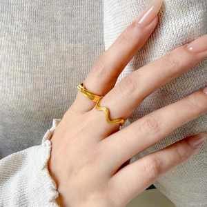 Stacked 18K gold-plated wave rings with sleek triangle and multi-line layered design
