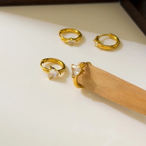 Set of four 18K gold plated titanium hoop earrings with triangle cut zircon stones
