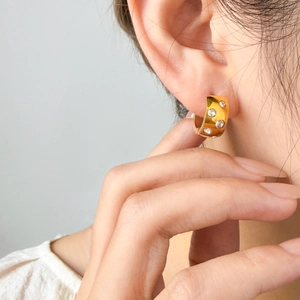 Wide 18K gold plated titanium hoop earrings with sparkling round cubic zirconia