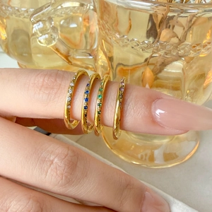 Set of four thin 18K gold-plated rings with colorful mini zirconia for stacking