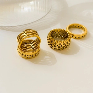 Set of four 18K gold plated stainless steel rings with hollow honeycomb and geometric wave designs