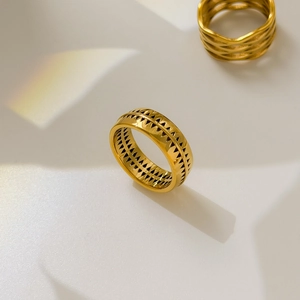 Detailed view of wide 18K gold plated ring featuring geometric hollow triangle pattern