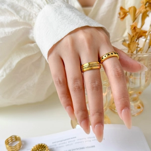 Set of 18K gold-plated titanium steel rings featuring hollow wave and geometric patterns