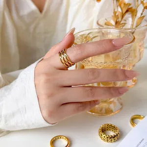 Golden 18K plated stainless steel rings featuring hollow honeycomb and wavy mesh designs