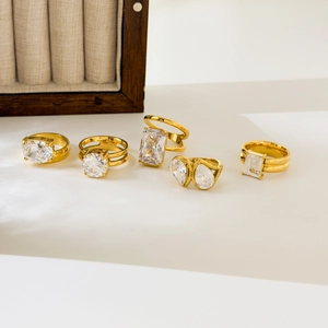 Five 18K gold plated titanium steel rings with oval, emerald, and pear cut cubic zirconia
