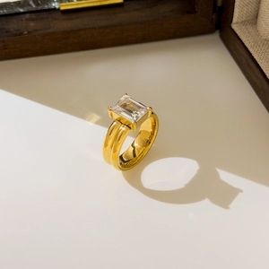 Detailed view of rectangle zircon inlay on a wide 18K gold plated stainless steel ring